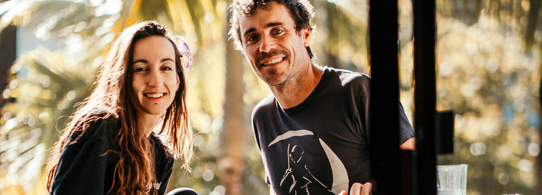 Grega and Anja close-up, palm bokeh